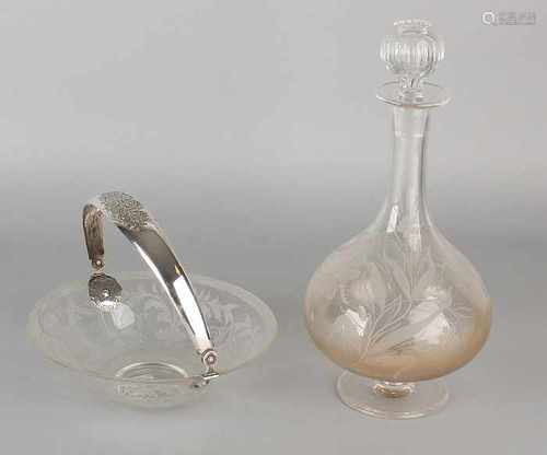 Two parts crystal with silver, a decanter and shell decorated with floral etched operation. The