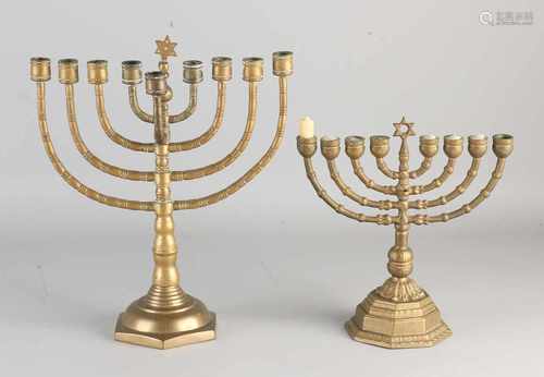 Two old Jewish Hanukkah brass candlesticks with Star of David. 9-armed. Size: 25-34 cm. In good