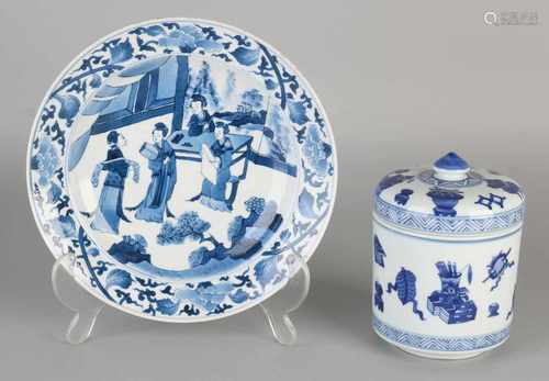 Two parts of Chinese porcelain. One time lidded with Chinese decor objects. One time Kang Xi