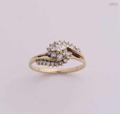 Yellow gold ring, 585/000, with diamonds. A rosette ring having a fantasy shape singlecut occupied