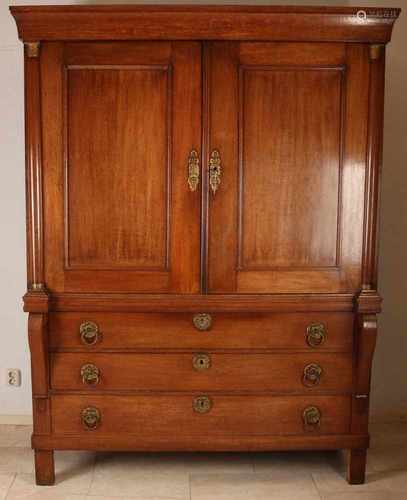 Dutch Empire oak cabinet with original gilt brass ring fitting, three-quarter columns and brass capi