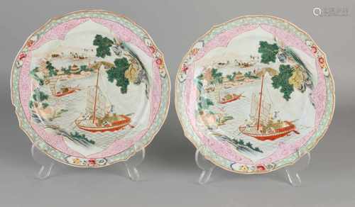 Two finely decorated Chinese porcelain plates with port / ship / figures and gold decor. With molded