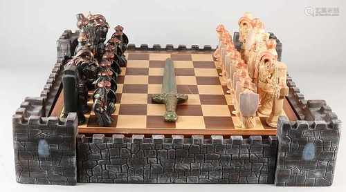 Large ceramic chess with medieval characters with wooden chessboard. Size: 26 x 60 x 60 cm. In