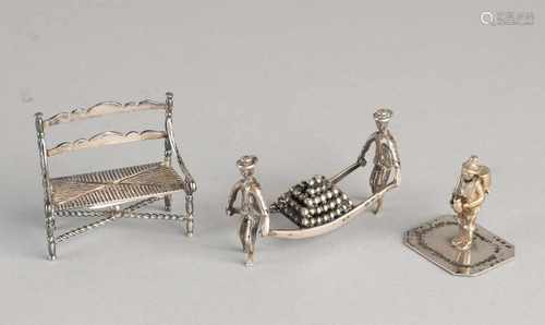 Three silver miniatures, 835/000, with cheese carriers, a bank and a man with barrel. 6x4x2cm, 5x2,