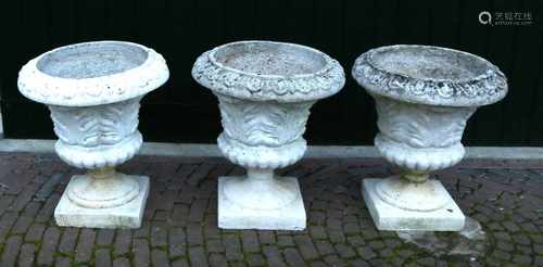 Three cast concrete vases. 20th century. Dimensions: H 50 x Ø 45 cm. In good condition.