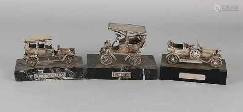 Three silver cars on basement. 835/000. A Ford 1903, a Rolls Royce and a 1909 Renault from 1907