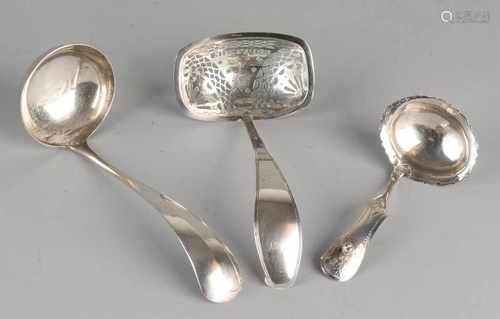 Three silver spoons, 833/000, one dispensing spoon with rectangular sawn container with shank is