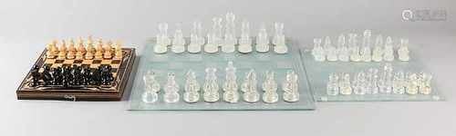 Three chess games. Comprising: Set glass becomes large. Set glass, small. Set wood, small. Size: 8 x