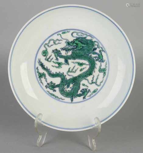 Chinese porcelain plate with dragon decor. Bottom Brand. Size: 4.5 x 21.5 cm dia. In good