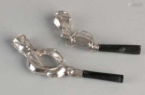 Two antique silver groom pipes, 833/000, one in the shape of a gun and one in the form of a