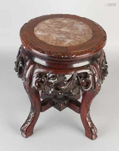 Wood Carved Chinese stool with marble top. 20th century. Dimensions: H 35 x Ø 32 cm. In good