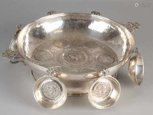Special silver serving dish with six trays, only includes old Spanish coins. Round hammered scale on