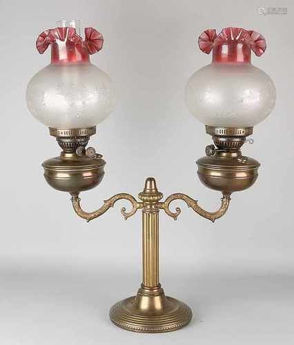 Large antique brass oil lamp with two burners and original glass shades. Circa 1900. One dent. Size: