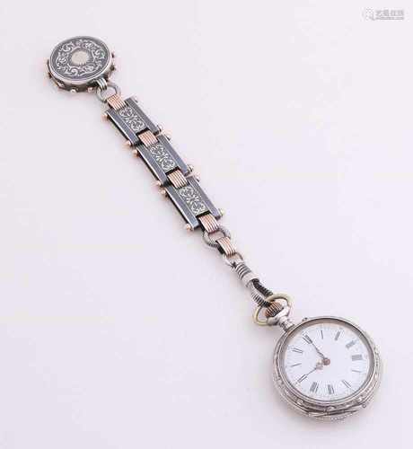 Silver hang watch with chatelaine provided with niëllo operation and pink accents. On the chatelaine