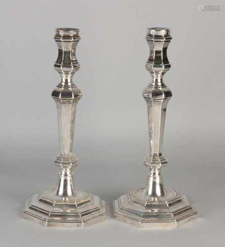 Two silver table candlesticks 800/000, Louis XIV style, on an octagonal base. ø13x29cm. MT .: