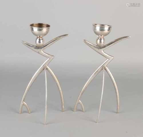 Two silver candlesticks 925/000, Art Deco, in the form of stylized figures. MT .: Orhan Güler.