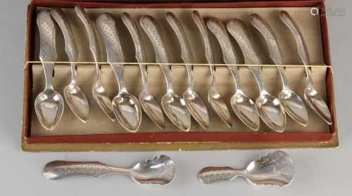 Silver spoons in cassette, 833/000. Set with 12 teaspoons, a sugar scoop and a tea thumb with molded