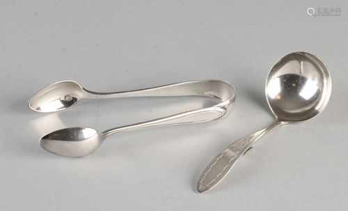 835/000 silver sugar tongs, model point fillet and 835/000 silver cream spoon with engraved shank.