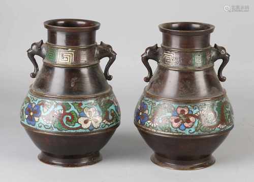 Two antique Japanese bronze vases with floral cloisonné. 19th century. Size: 18 x 12 cm dia. In good