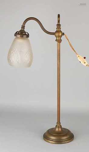 Antique brass desk lamp with faceted glass cap. Adjustable in height. Circa 1920. Dimensions: 56 cm.