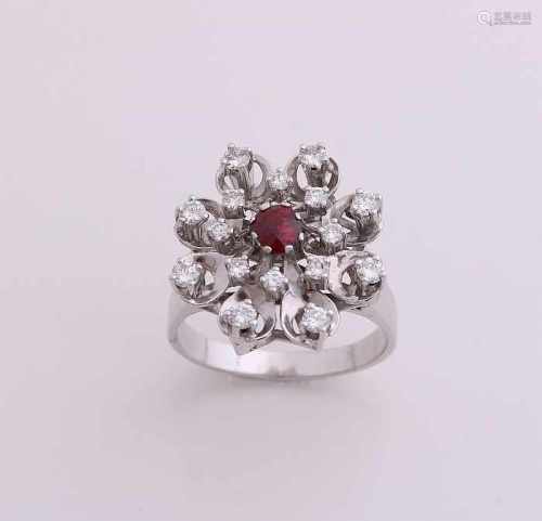 Beautiful gold ring, 585/000, with diamond and ruby. Ring with a large rosette in a flower shape, in
