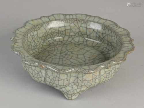 Chinese celadon porcelain dish with crackle glaze and molded rim. Size: 6 x 19.3 cm dia. In good