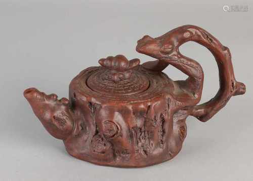 Chinese Yixing teapot with bark / slag decor. Size: 11 x 19 x 9.5 cm dia. In good condition.