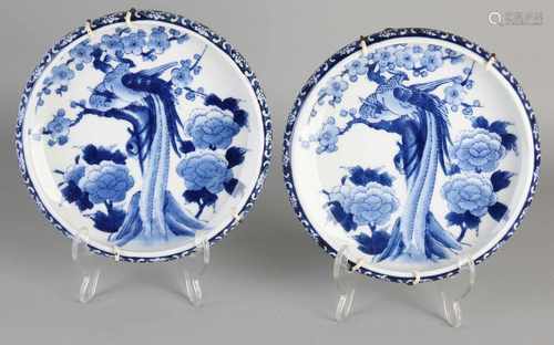 Two Imari porcelain bowls with paradise scenery. Second half 20th century. Size: 3.5 x 19 cm dia. In