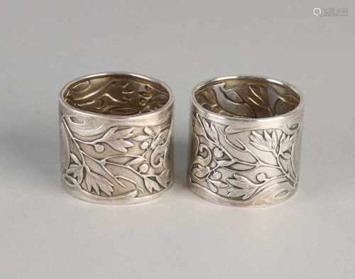 Two round silver napkin bands, 800/000, Art Nouveau, decorated with floral decor and a cartouche. MT