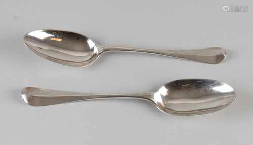 Two antique silver spoons. One time in Amsterdam 'praise and steel, round model with comb. Mr. Lucas