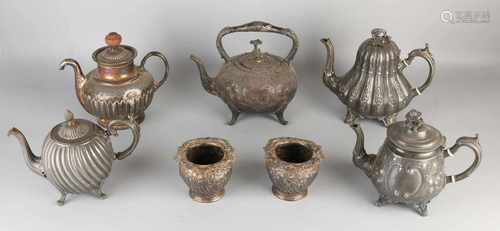 Seven parts antique pewter tableware. Circa 1900. Comprising: Two vases and five teapots. Size: 10-