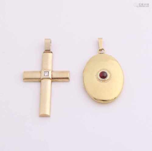 Two gold silver pendants, 925/000. A medallion, oval model with red stone, 40x23mm, and a cross with