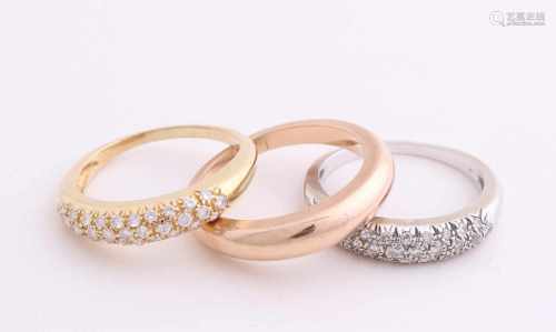 Gold rings, a white gold and yellow gold ring, 750/000, set with diamonds and a rose gold ring,