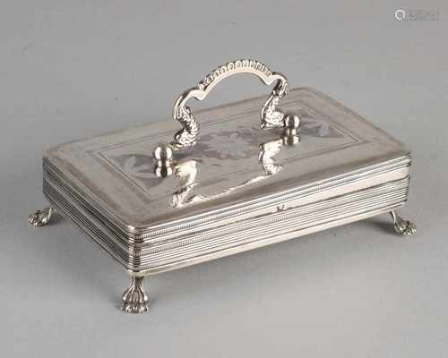 Silver spoon box, 833/000, rectangular model placed on four claw feet, decorated with engravings,