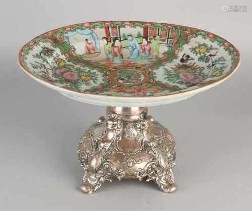 Cantonese dish placed on heavy silver base, 800/000, with four curved legs decorated with lions'
