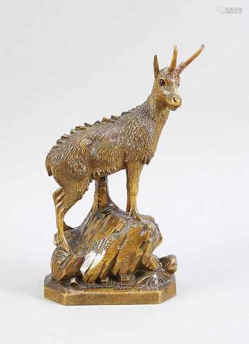 German crossed from lime wood gemsbok on rock. Circa 1930. Glass eyes. Size: H 34 cm. In good