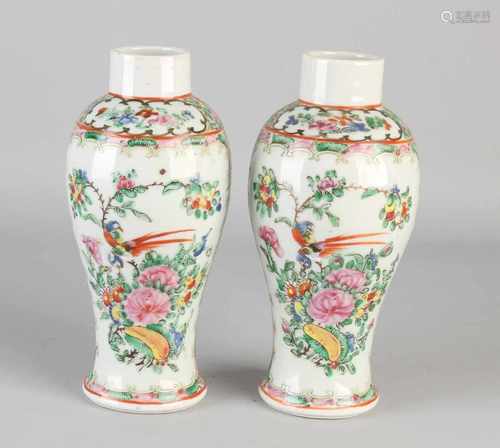 Two 18th - 19th century Cantonese, Chinese porcelain vases with figures in interior decor.