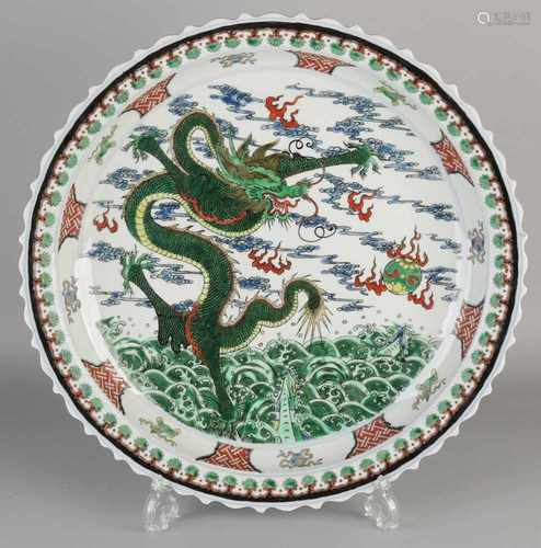 Large Chinese porcelain dish Verte Family with dragons in clouds decor. With molded rim. Six signs