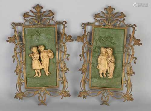 Two antique German Jugendstil bronze wall plaques with figures and floral decor whiplash. Circa