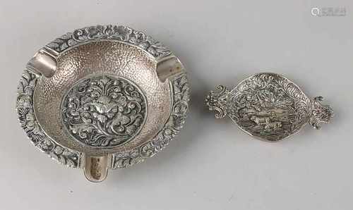 Silver tray and ashtray. Small silver tray with machined ears is provided with a representation with