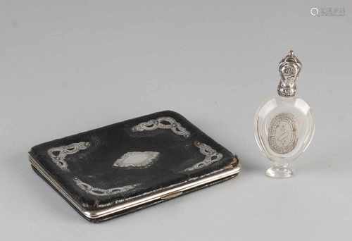 Cigarette case and perfume bottle with silver, 833/000. Leather tube with steel hinge decorated with