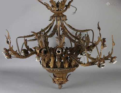 Large antique bronze Rococo-style chandelier with porcelain fittings. 16-Light. Circa 1900. Any