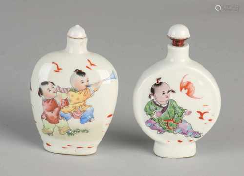 Two great ancient Chinese porcelain snuff bottles with children decor and bottom mark. Size: 9,5 -