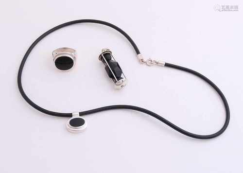 Three silver jewelry with black stones, 925/000. Leather necklace with silver lock and a silver