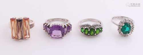 Four silver rings with colored stones. a total of approximately 25.4 grams. In good condition