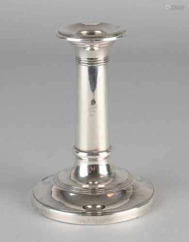 Silver candlestick, 925/000, on circular base. The candle holder is on the edge is provided with