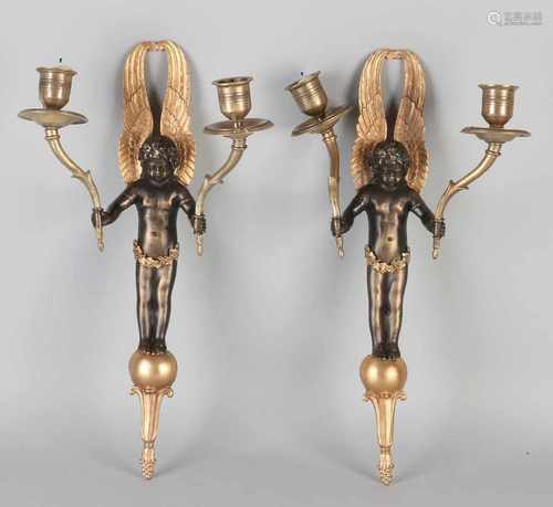 Two Empire style bronze candle candlesticks with angels. Two-colored. 20th century. Size: 35 cmm. In