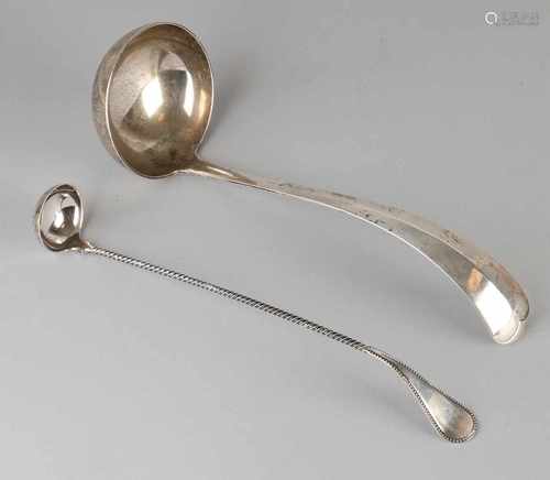 Two silver spoons, 833/000, a morellenlepel with a twisted handle on a roll. MT .: J.A.A.