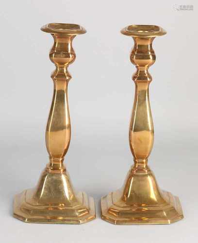 Two baluster antique brass candle candlesticks. First half 20th century. Size: H 26 cm. In good