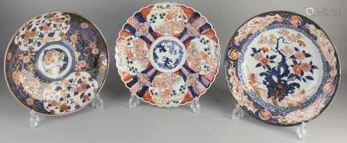 Three large 19th century Imari porcelain dishes. One time floral / gold decor, restored. One time